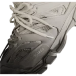 Balenciaga Unveils Striking Track Gradient Black/Beige Sneakers, Merging Avant-Garde Design with Functional Innovation
