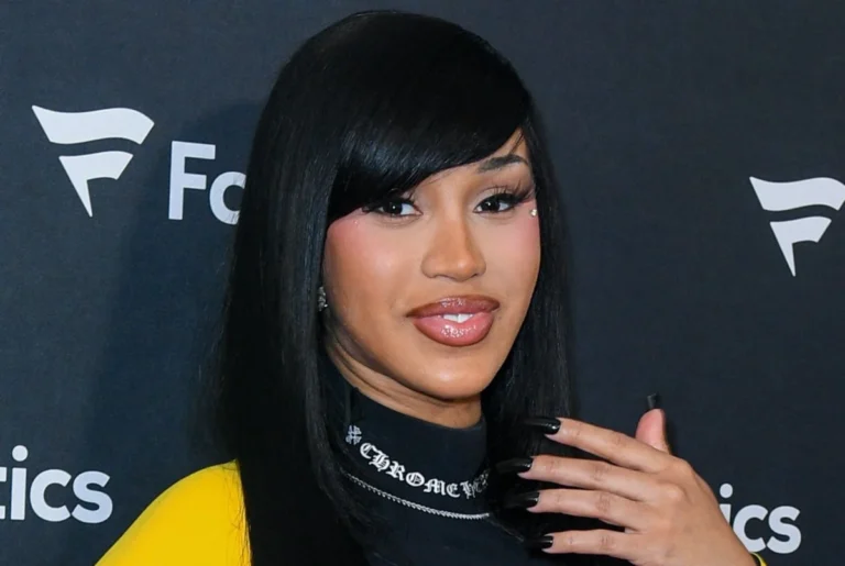 Cardi B Channels Rainbow Brite in a Dazzling Purple Ombre Halter Dress and Vibrant Rainbow Updo