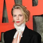 Charlize Theron Challenges Spring Manicure Norms with Edgy Black Cherry and Baby Blue Micro-French Tips