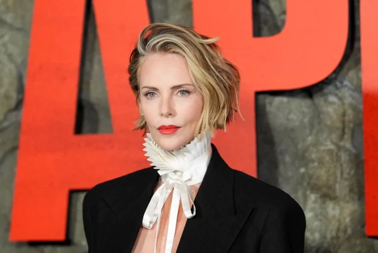 Charlize Theron Challenges Spring Manicure Norms with Edgy Black Cherry and Baby Blue Micro-French Tips