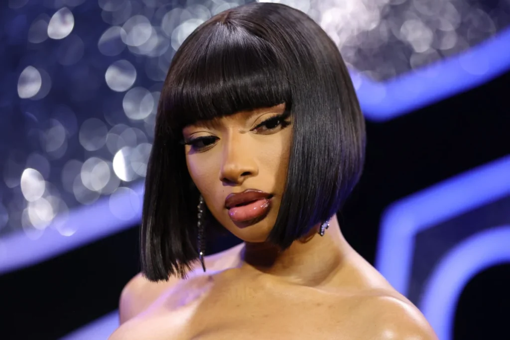 Megan Thee Stallion Dazzles Miami Swim Week with Electrifying Neon Green Updo