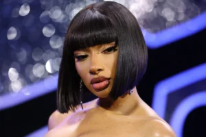 Megan Thee Stallion Dazzles Miami Swim Week with Electrifying Neon Green Updo