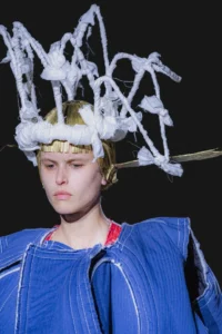 Comme des Garçons Spring/Summer 2027 Paris Fashion Week Showcase Subverts Monochromatic Resistance With Sculptural Royal Satire