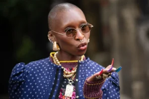 Cynthia Erivo brings a vibrant touch of Oz to Paris Fashion Week with an avant-garde multicolored croc-textured manicure